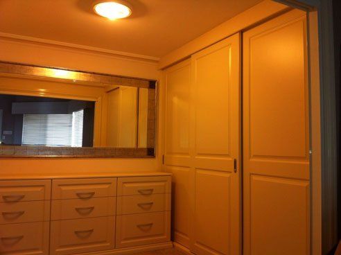 vinyl wrap walk in wardrobe with long horizontal mirror on wall