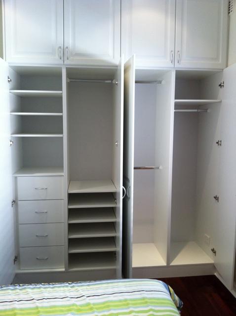built in hinged vinyl wrap wardrobe with drawers and shelving