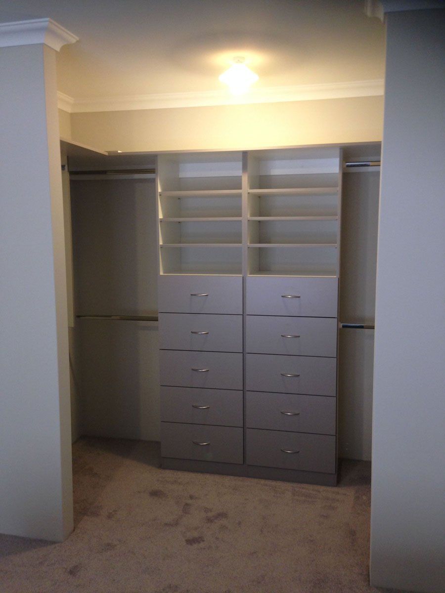 walk in wardrobe with formica mulga coloured fronts