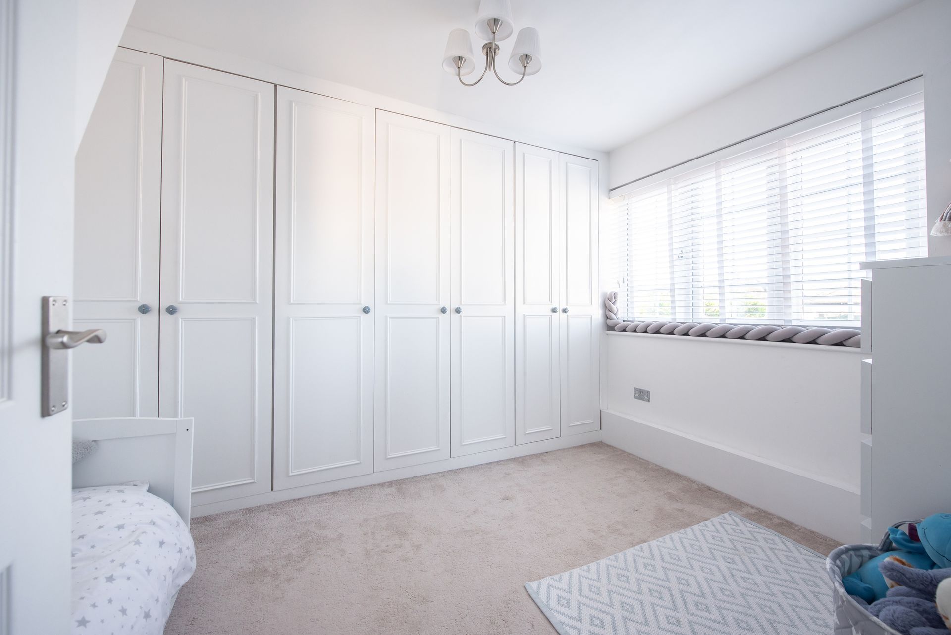 A general interior view of a child's nursery bedroom with floor to ceiling wardrobes |  Perth 