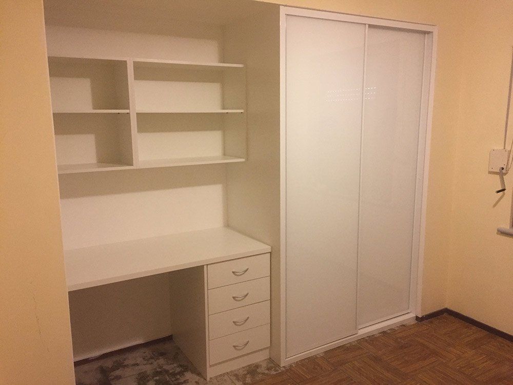 desk with shelves and closet