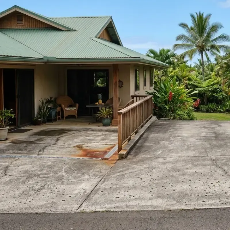Hawaii concrete slab, lanai, and driveway showing hairline cracks and early signs of wear, emphasizing routine inspection for homeowners