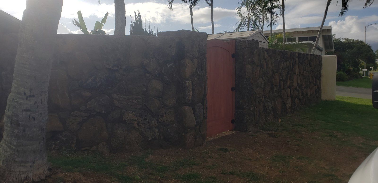 lava rock wall at North Shore With Gate door