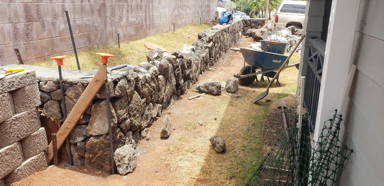 lava rock wall under construction in Hawaii