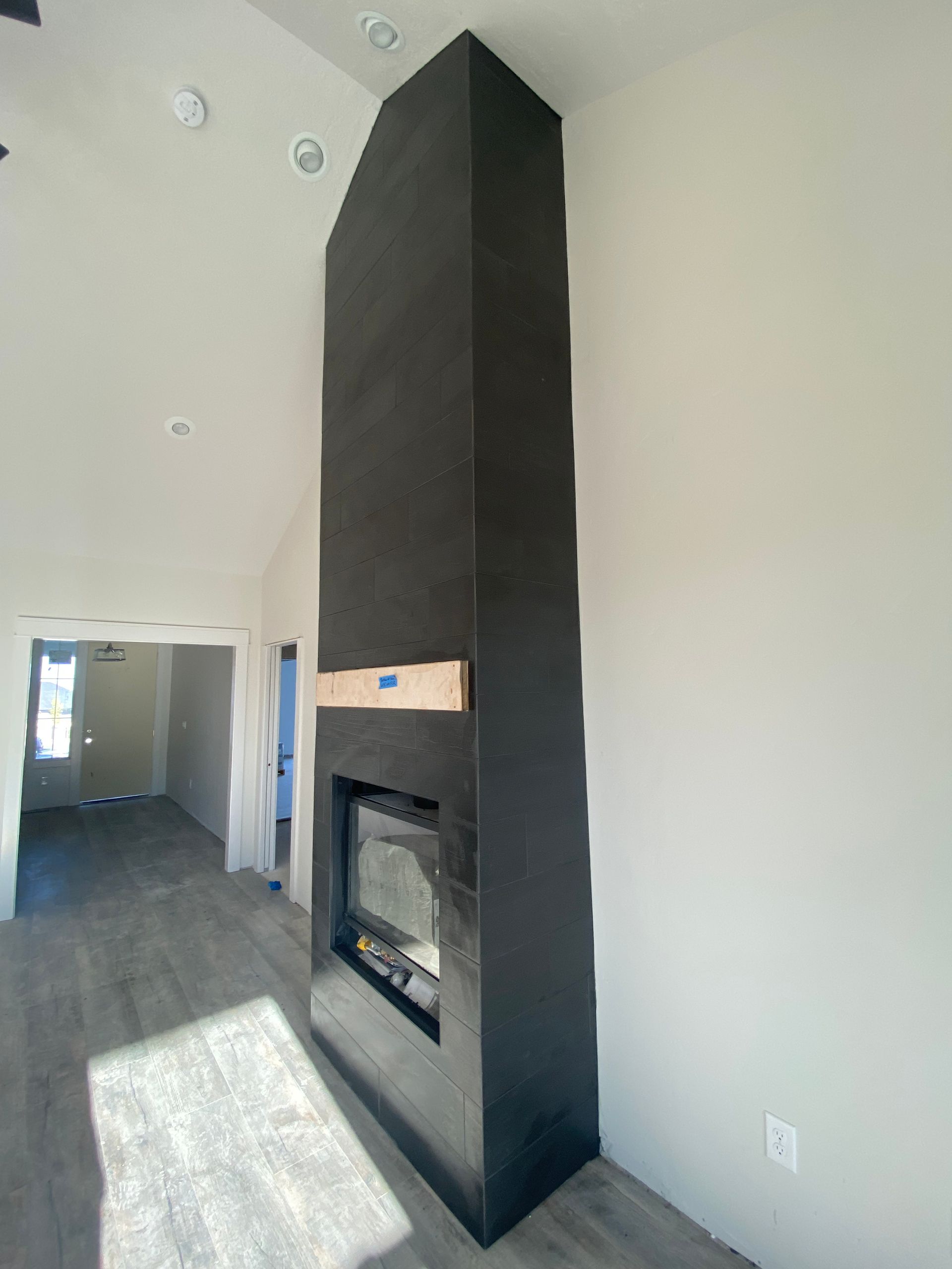 There is a fireplace in the middle of the room.