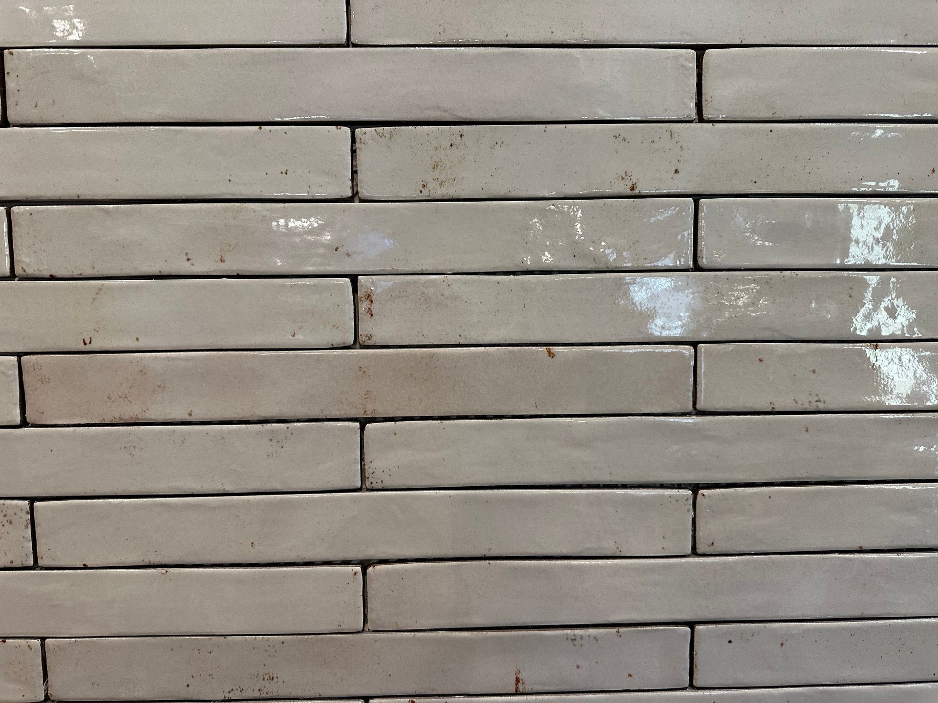 A close up of a white brick wall