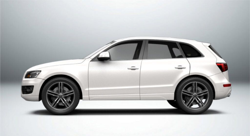 Um suv branco com rodas pretas está sentado em uma superfície branca.