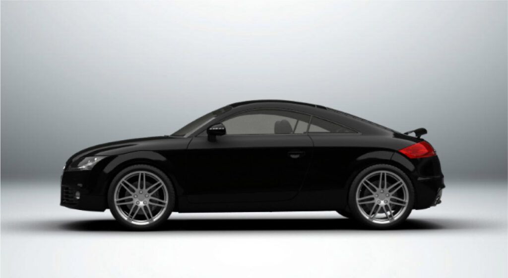 Um carro esportivo preto está parado em uma superfície branca.