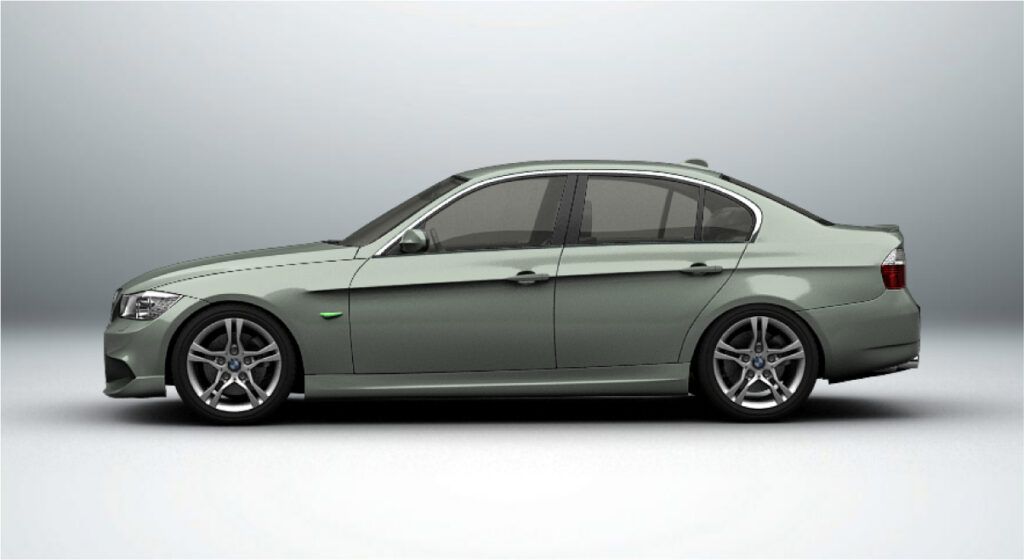 Um bmw cinza está estacionado em uma superfície branca.