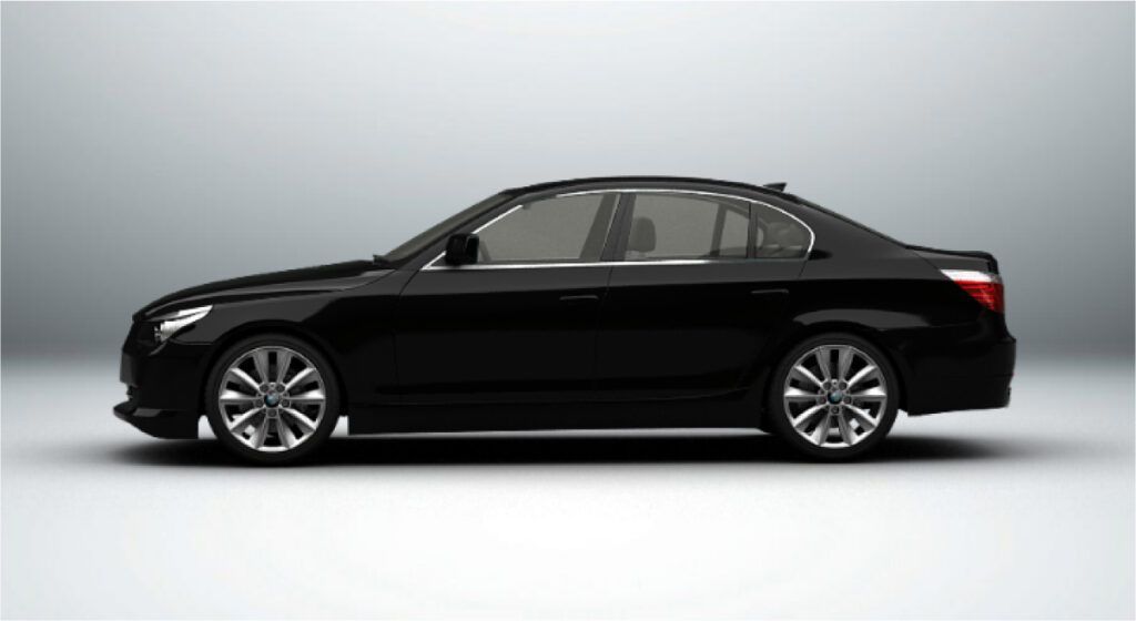 Um carro preto está parado em uma superfície branca.