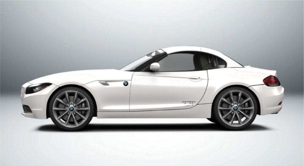 Um bmw z4 branco é mostrado de lado em um fundo branco.