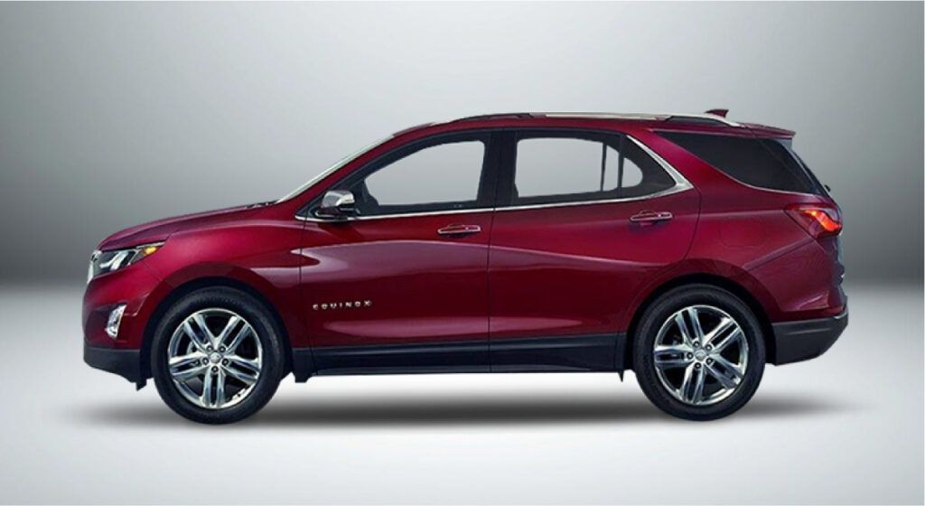 Um suv vermelho está sentado em uma superfície branca.