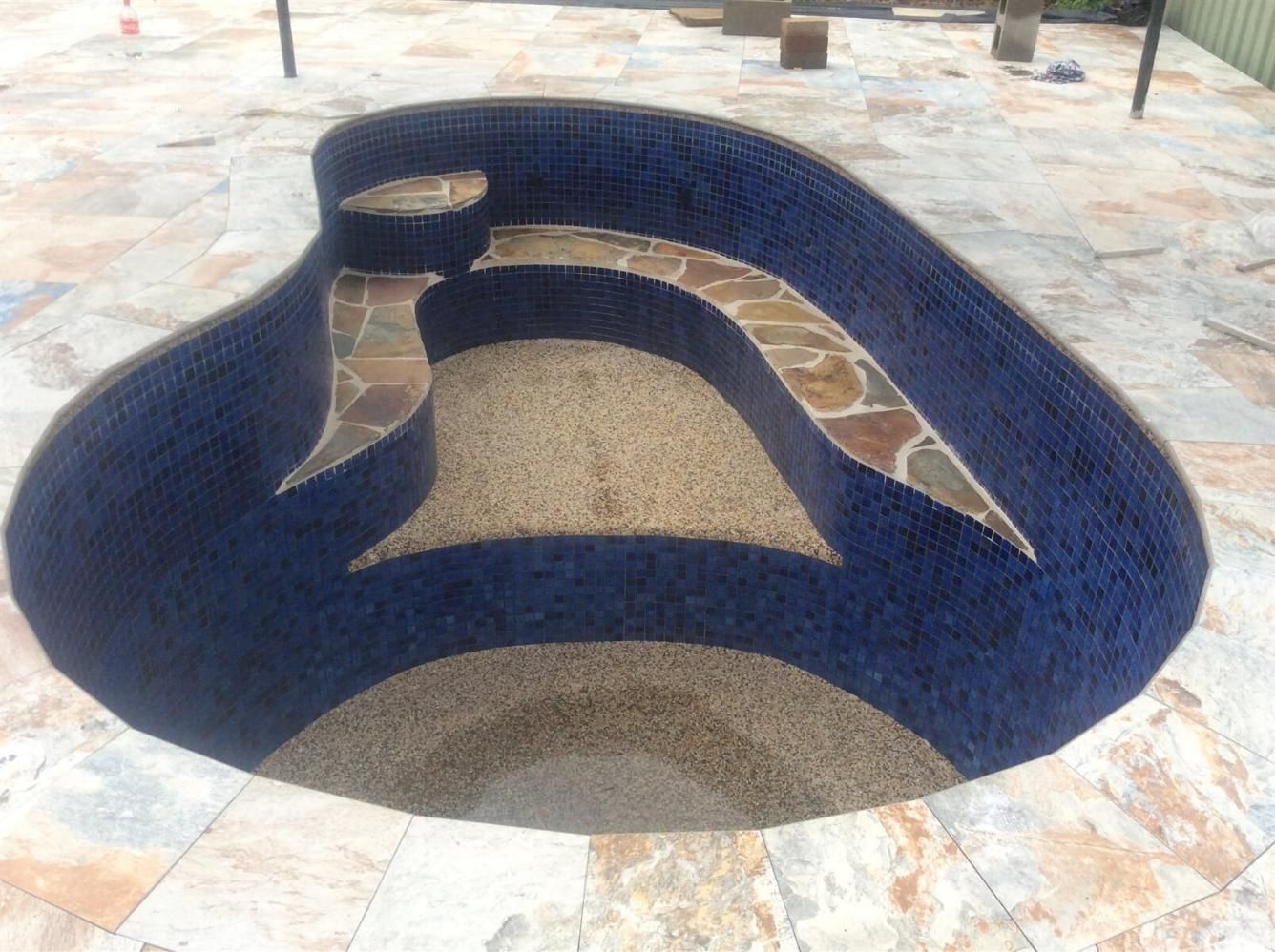 Swimming Pool With Blue Tiles And Stone Steps — Paving in Darwin River, NT