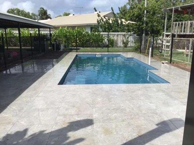Marble Tiles And Fence Around The Pool — Paving in Darwin River, NT