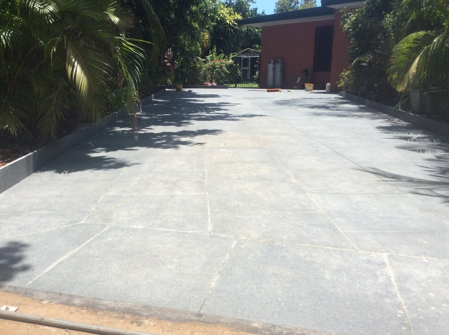 Concrete Driveway Of A House with Plants on Either Side — Paving in Darwin River, NT