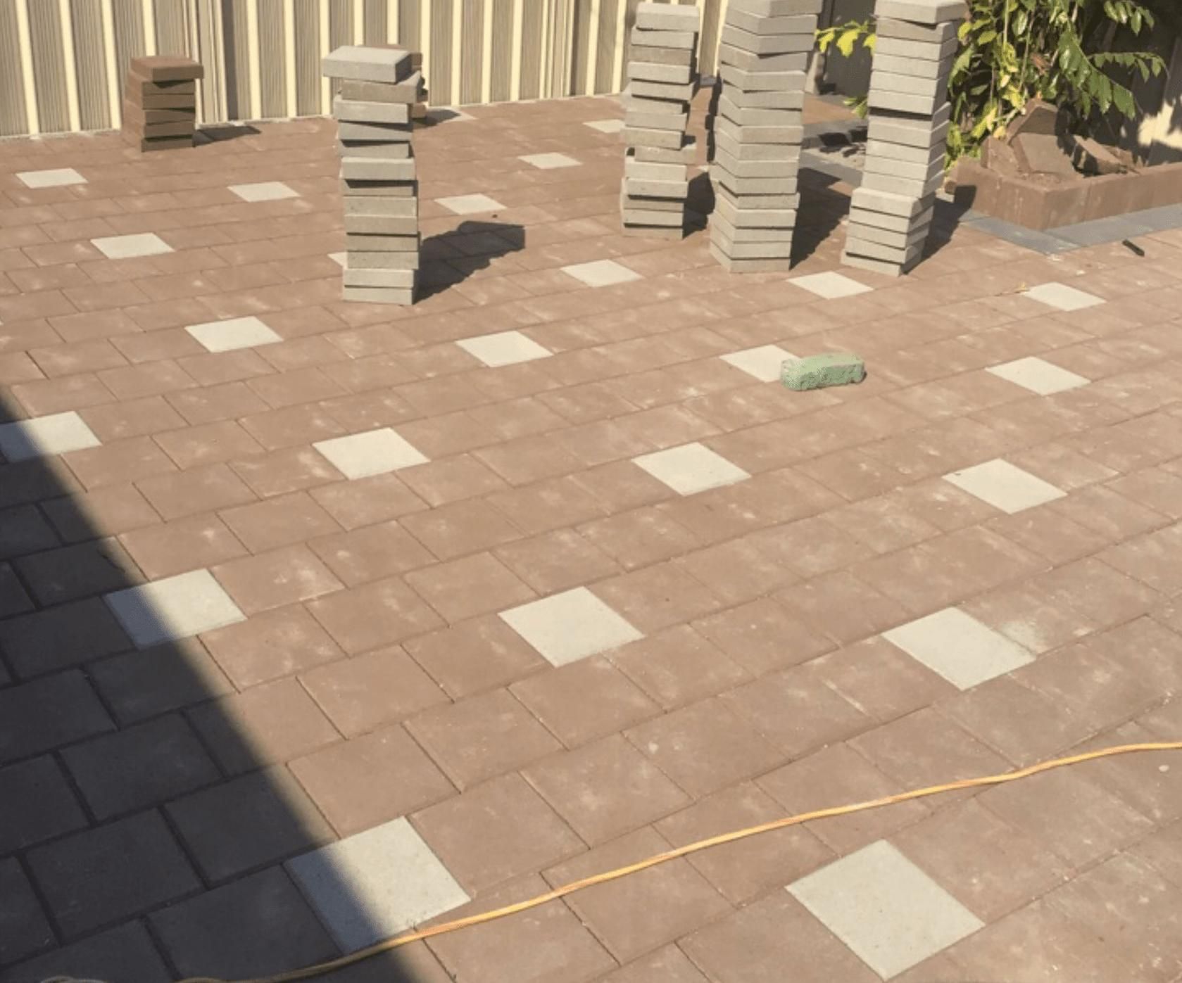 Row Of Bricks Stacked On Top Of Each Other On A Patio — Paving in Darwin River, NT