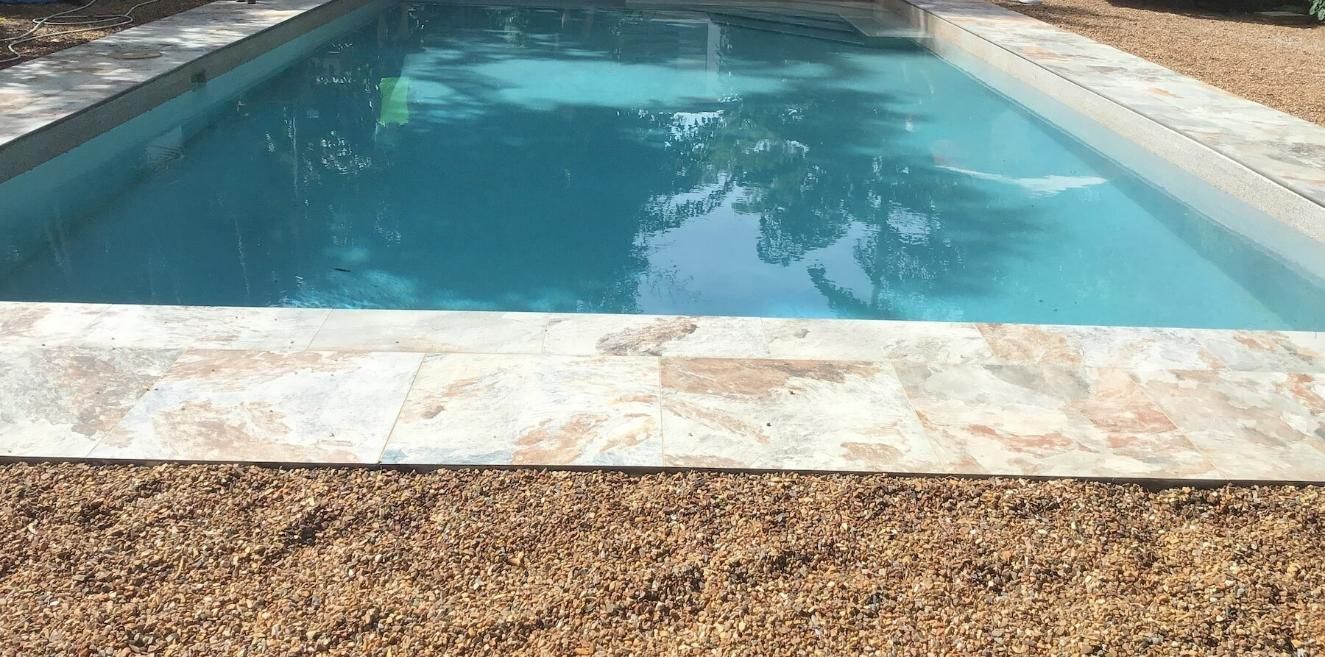 Marble Tiles And Pebbles Around The Pool — Paving in Darwin River, NT