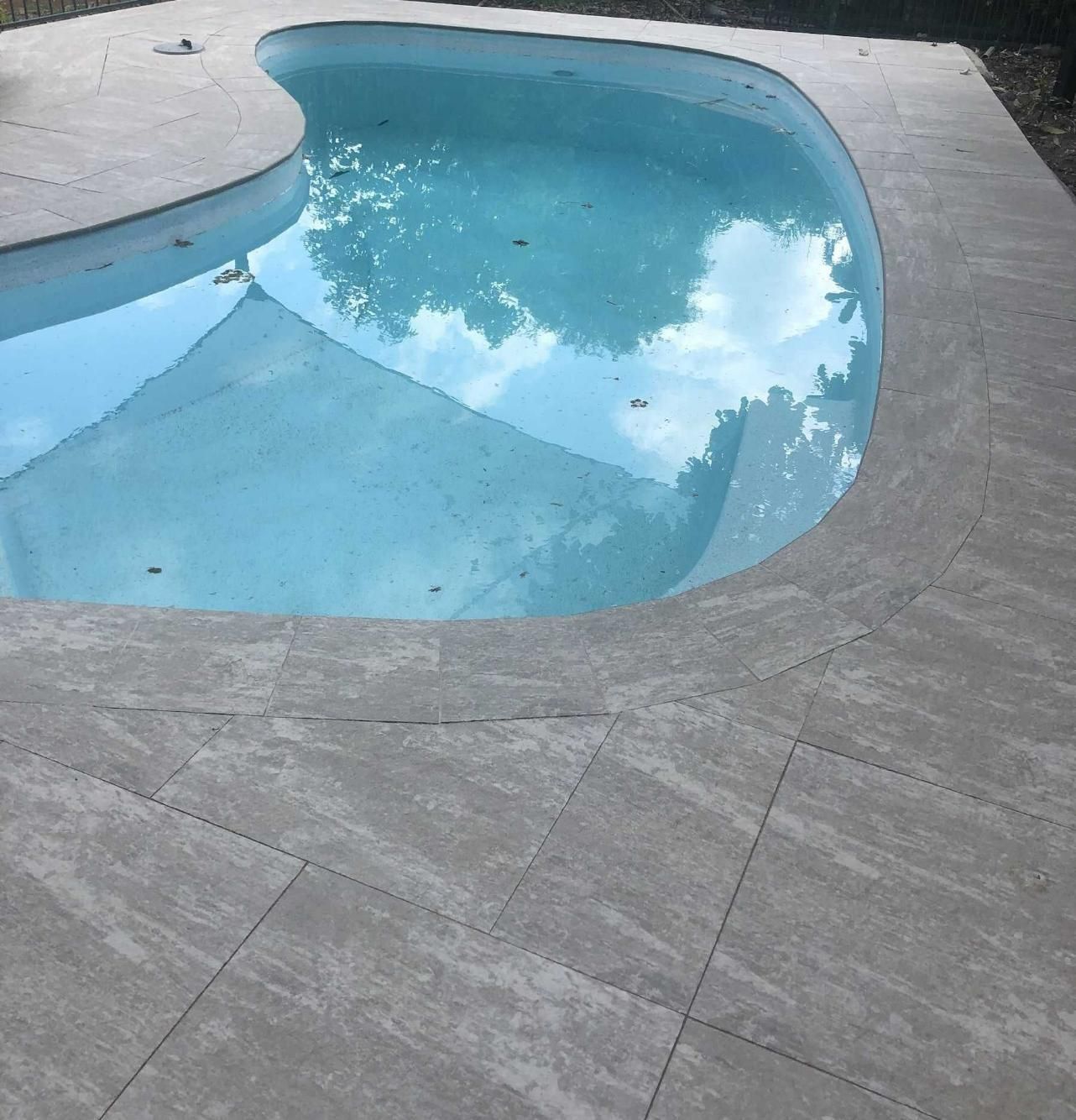 Large Swimming Pool Surrounded By Grey Pavers — Paving in Darwin River, NT