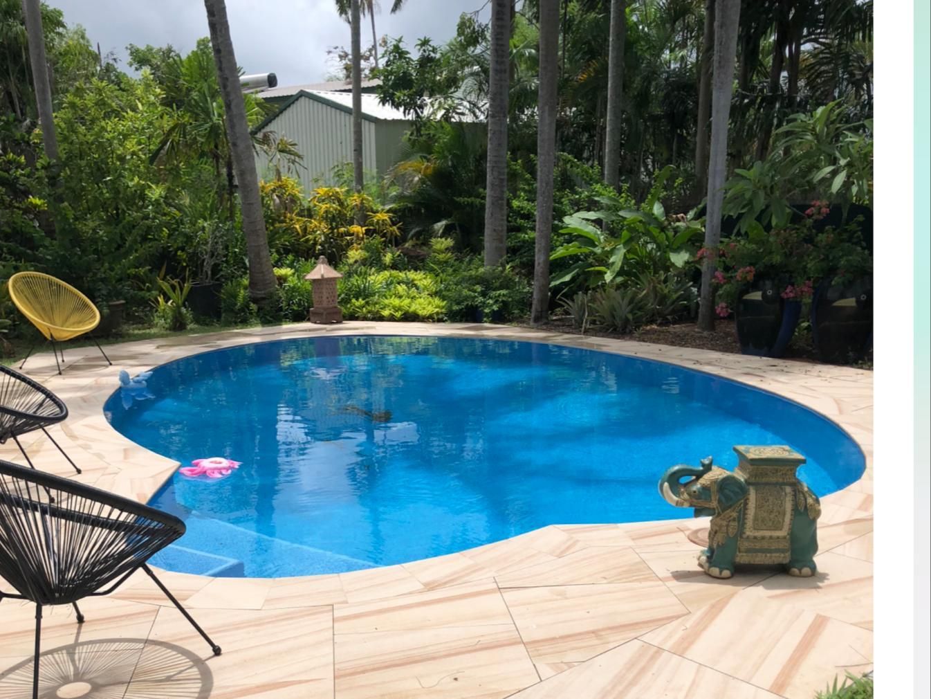 Beige Coloured Tiles Around The Pool and Trees in the Background — Paving in Darwin River, NT
