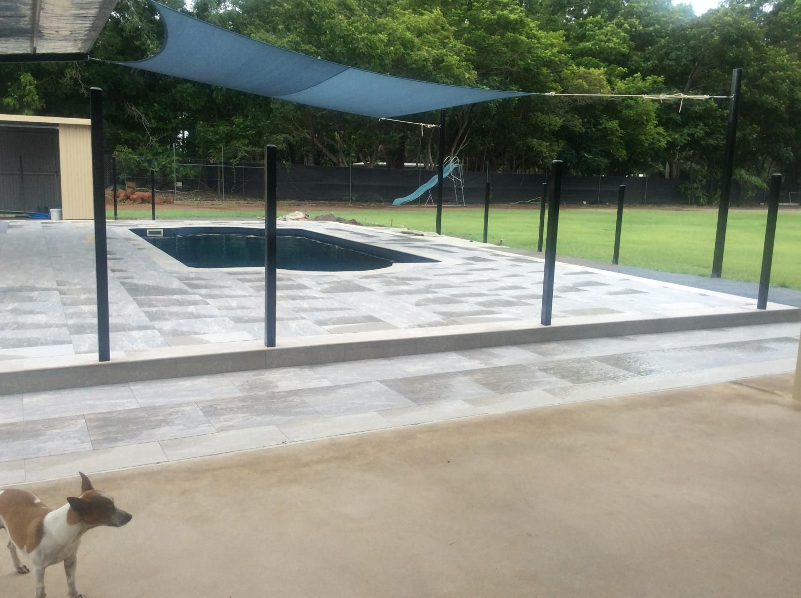 Swimming Pool With Pool Shade and Trees in Background — Paving in Darwin River, NT