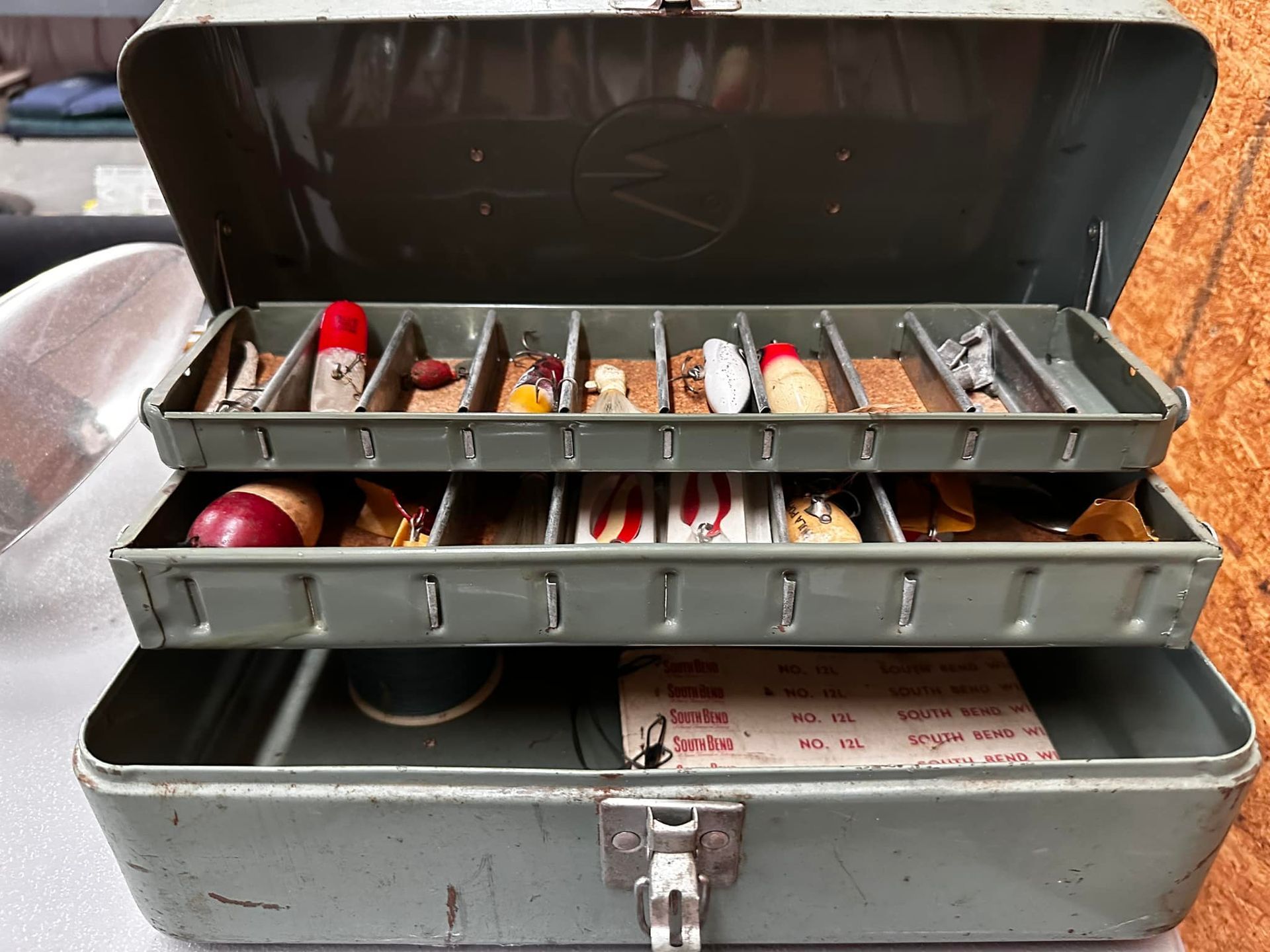 a fishing tackle box filled with fishing lures and hooks