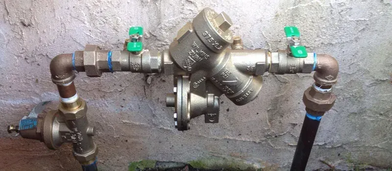 Leaking copper pipes with water dripping indoors