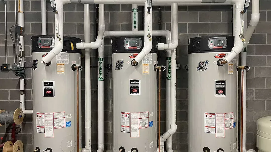Leaking copper pipes with water dripping indoors
