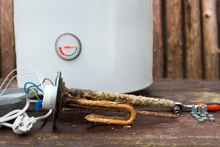 Leaking copper pipes with water dripping indoors