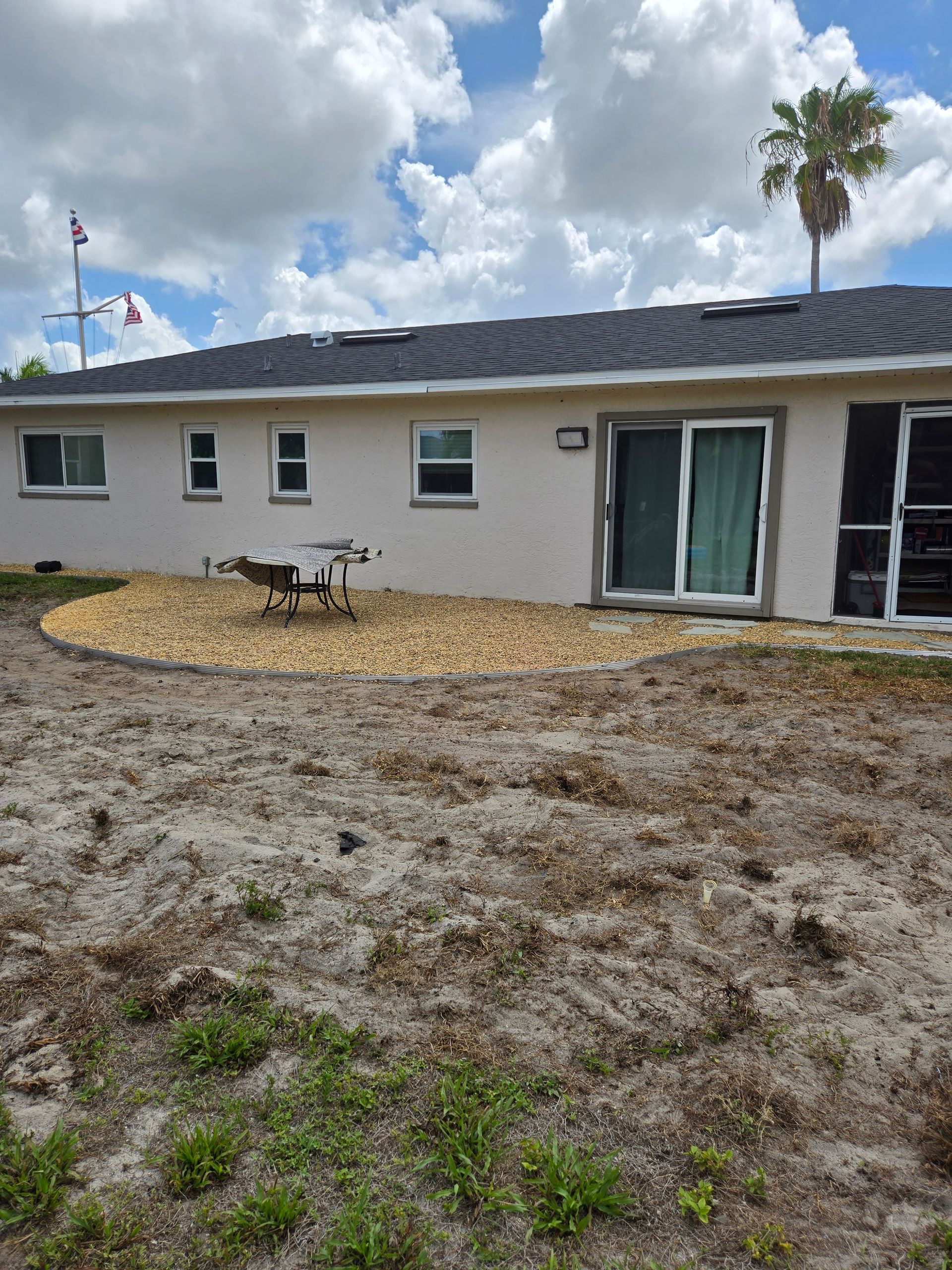 A house with a lot of dirt in front of it