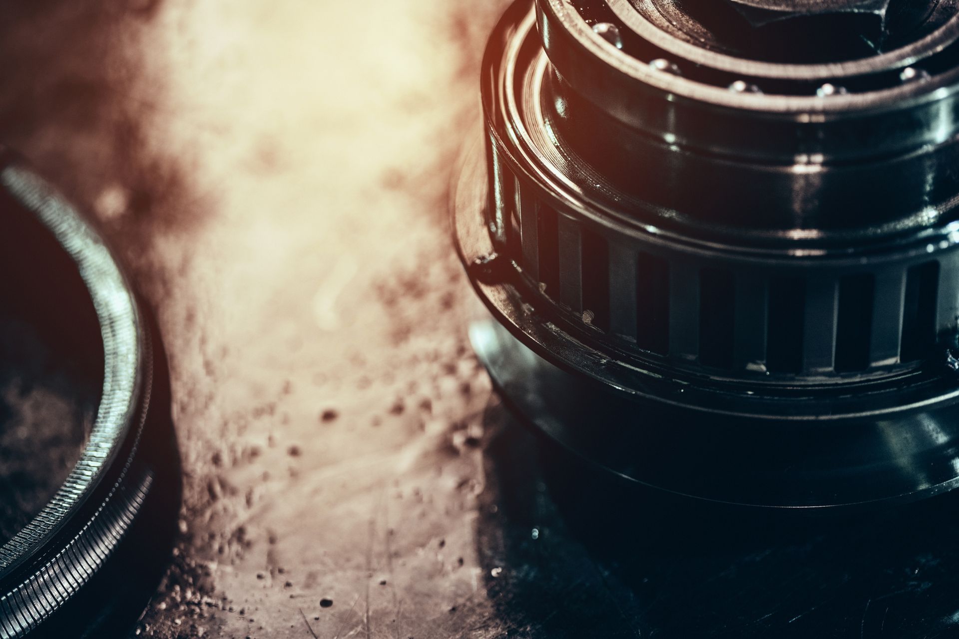A bunch of gears are laying on a wooden table