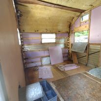 The inside of a trailer that is being remodeled.