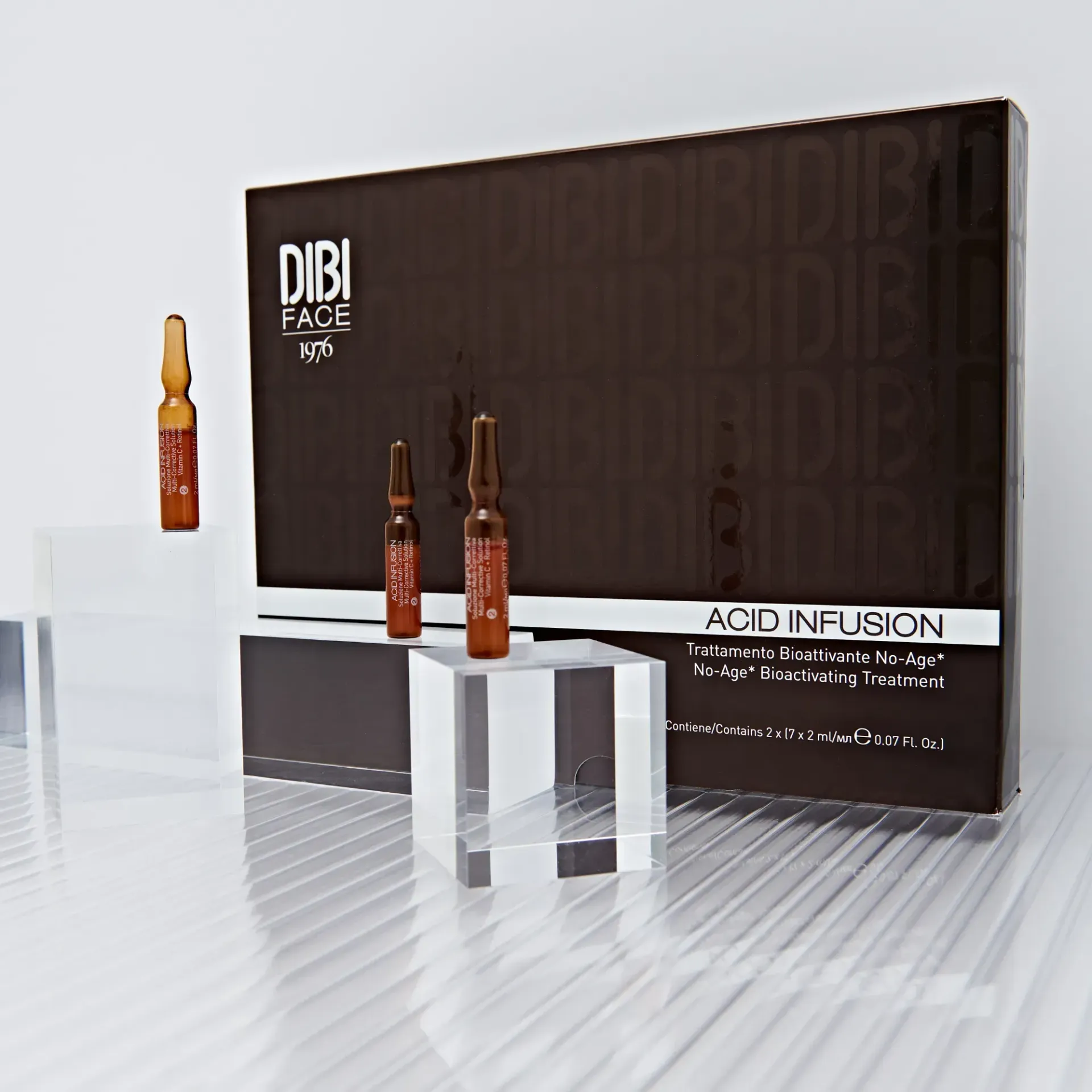 Confezione marrone di fiale DIBI FACE 100 Acid Infusion su blocchi trasparenti.