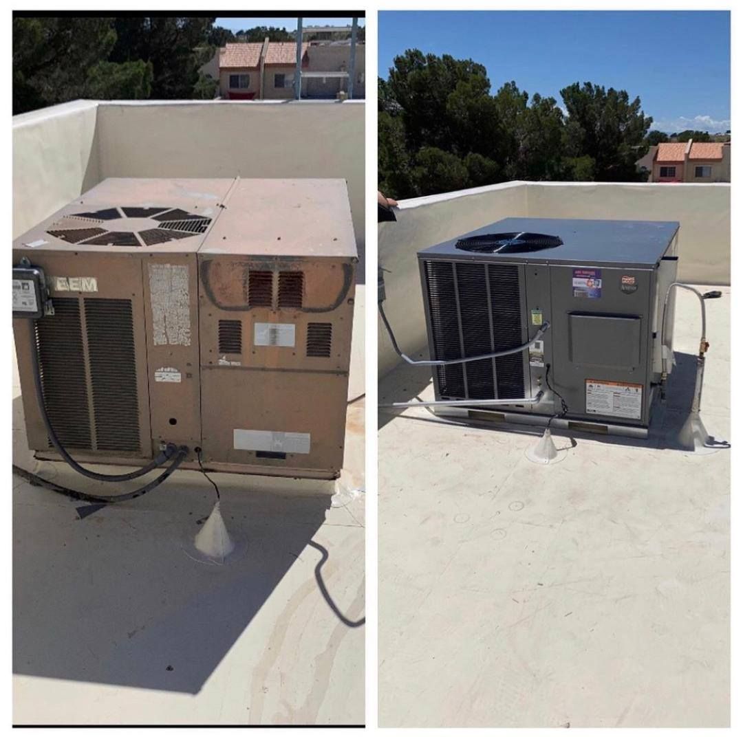 Two rooftop HVAC units; one old and weathered, the other new and gray, on a flat roof.