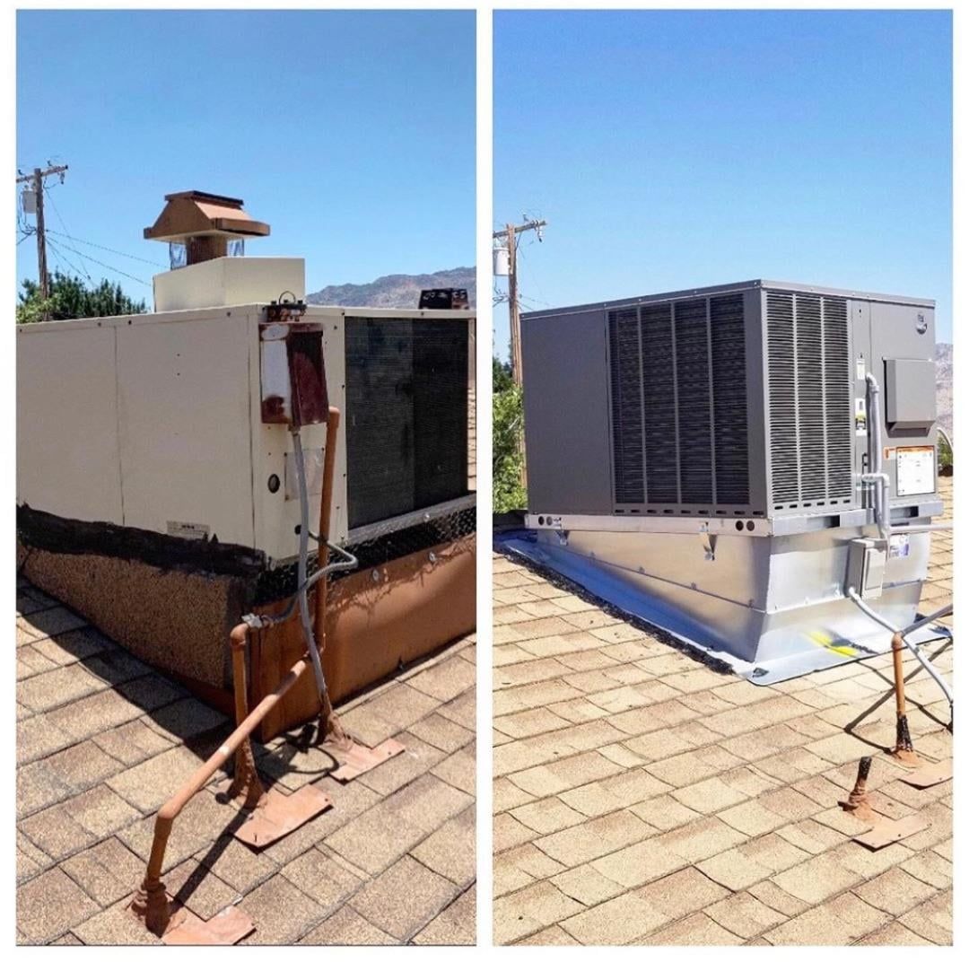 Two rooftop HVAC units, one old and damaged, the other new and in good condition, on a sloped roof.