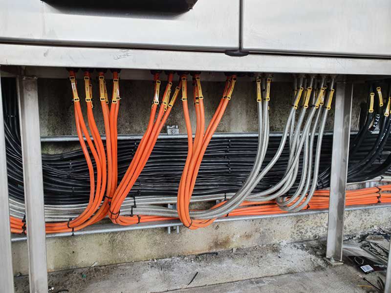 A Bunch Of Wires Are Connected To A Metal Electrical Box — Entire Trades in Cessnock, NSW