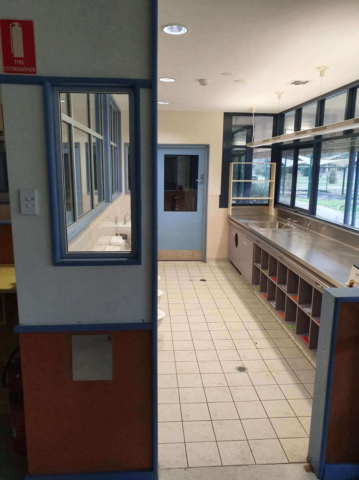 A Room with A Lot of Windows and A Blue Door — Entire Trades in Singleton, NSW