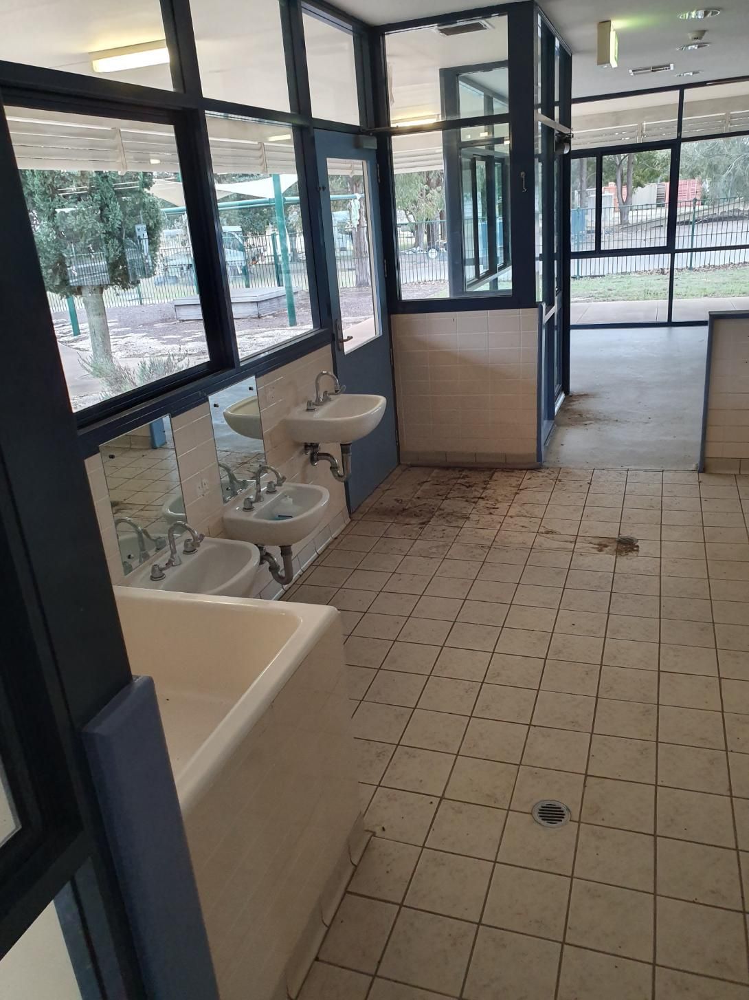 A Bathroom with A Lot of Windows and Sinks — Entire Trades in Singleton, NSW
