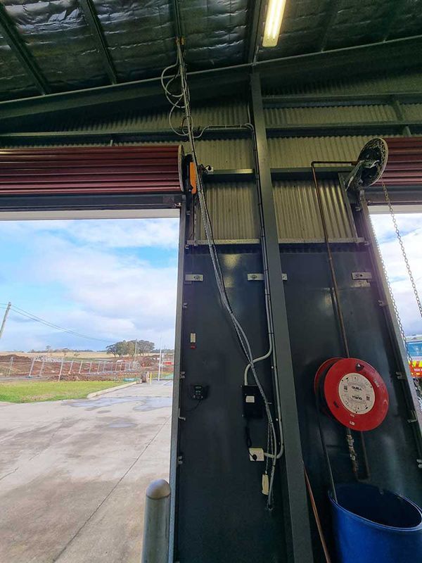 New Installed Power Supply On The Warehouse Grey Wall — Entire Trades in Cessnock, NSW