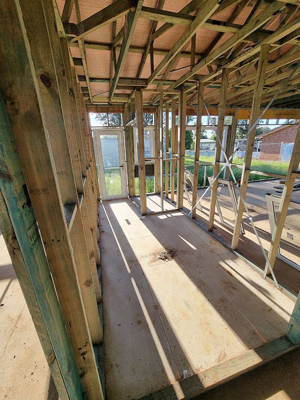 Construction With Wooden Beams And A Door — Entire Trades in Central Coast, NSW