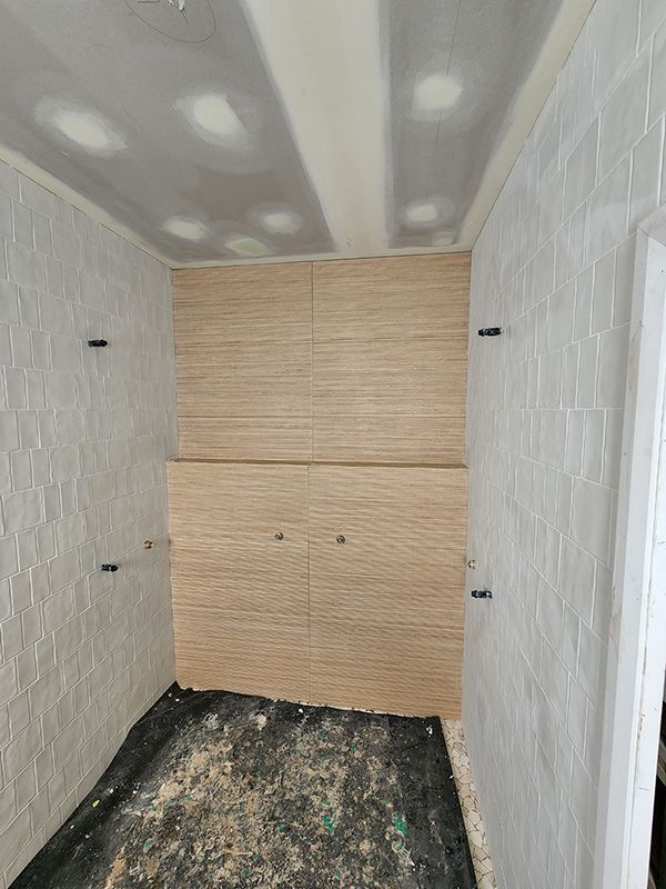 Bathroom With White Tiles Under Construction — Entire Trades in Singleton, NSW
