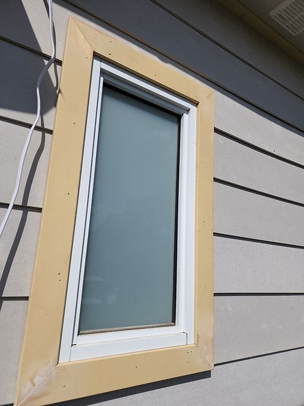 A House Window With A White Frame  From Outside — Entire Trades in Cessnock, NSW