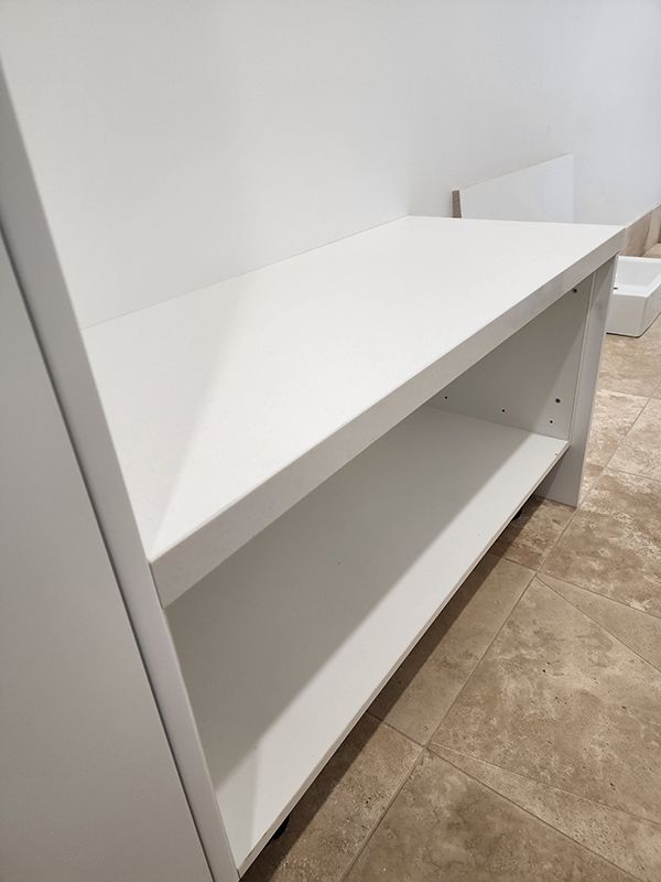 A White Shelf With Three Levels On Floor — Entire Trades in Cessnock, NSW
