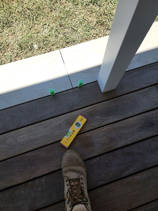 A Wooden Deck Next To A Yellow Level Indicator — Entire Trades in Singleton, NSW
