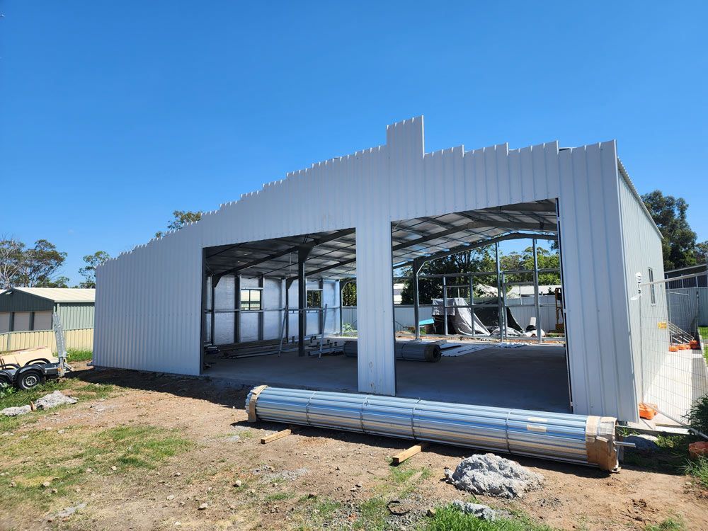 A Large White Building Warehouse Construction — Entire Trades in Maitland, NSW