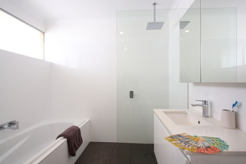 Bathroom With A Shower And A Sink — Entire Trades in Maitland, NSW