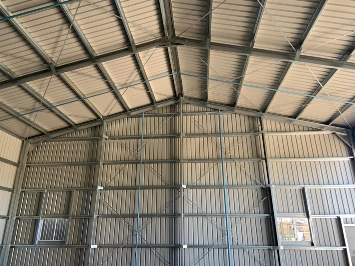 The Inside of A Large Building with A Metal Frame and Wooden Walls — Entire Trades in Maitland, NSW