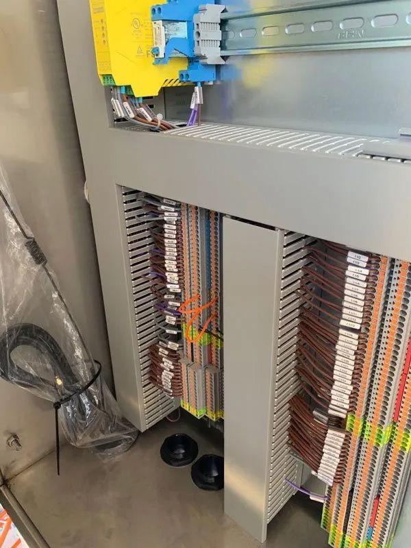 A Large Electrical Panel With Wires And Cables, Ready For Installation In A Commercial Building — Entire Trades in Cessnock, NSW