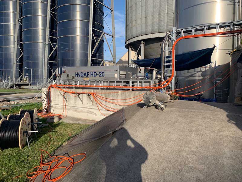 Laying And Installing Orange Wires To The Big Tank — Entire Trades in Cessnock, NSW