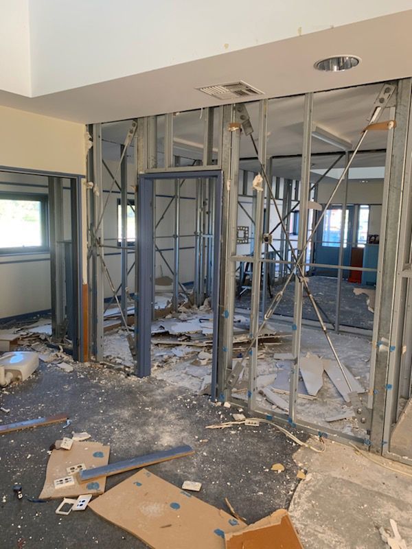 A Space Filled With Construction Equipment And Debris — Entire Trades in Port Stephens, NSW