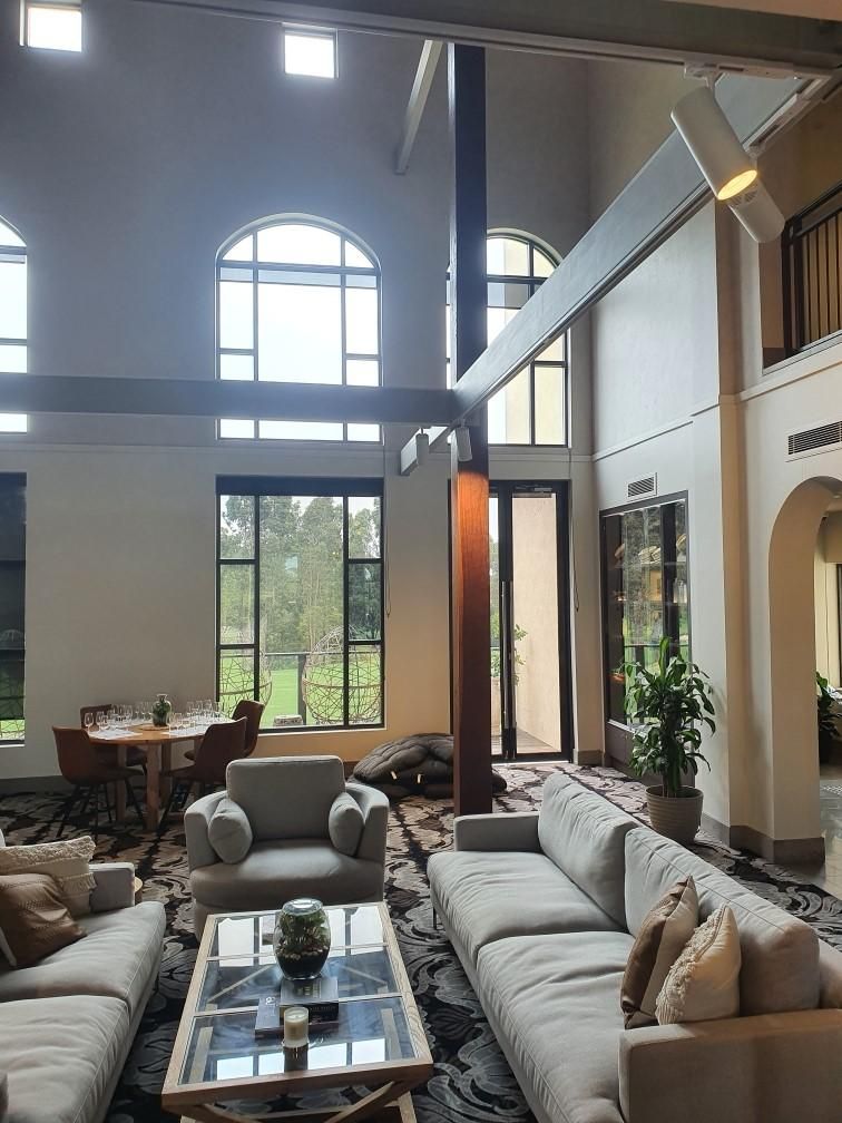 A Living Room with A Lot of Furniture and A Table — Entire Trades in Maitland, NSW